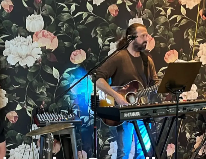 James Richard performing solo with guitar